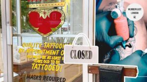 door-of-tattoo-studio-with-sign-saying-closed
