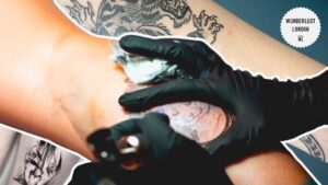 tattoo-artist-in-the-middle-of-a-session-on-a-large-backpiece